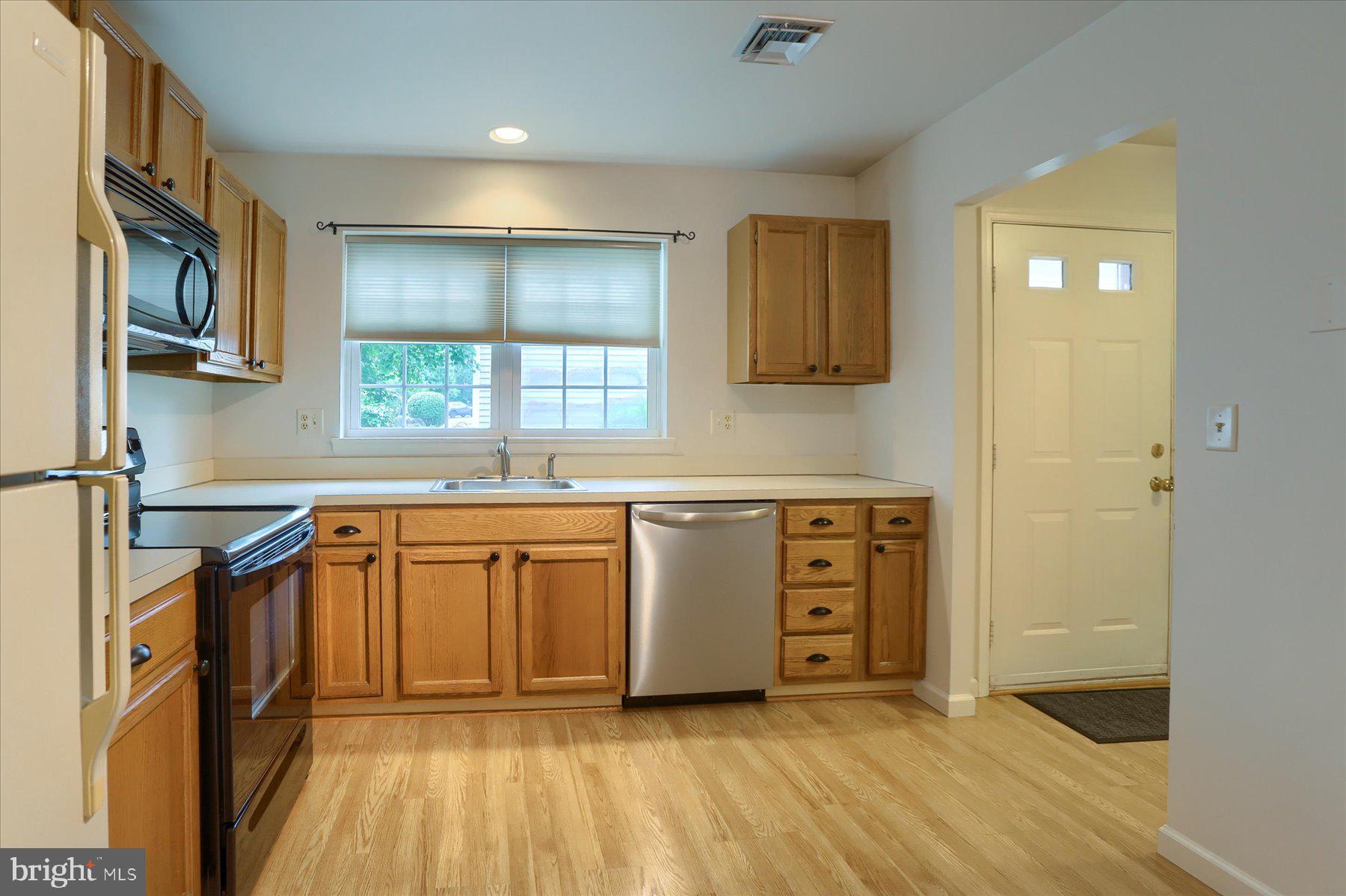 802 Cambridge Court Palmyra, PA 17078 - Photo 8 of 32 a kitchen with stainless steel appliances granite countertop a stove a sink and a refrigerator