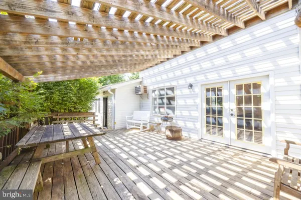 a view of a balcony with wooden floor