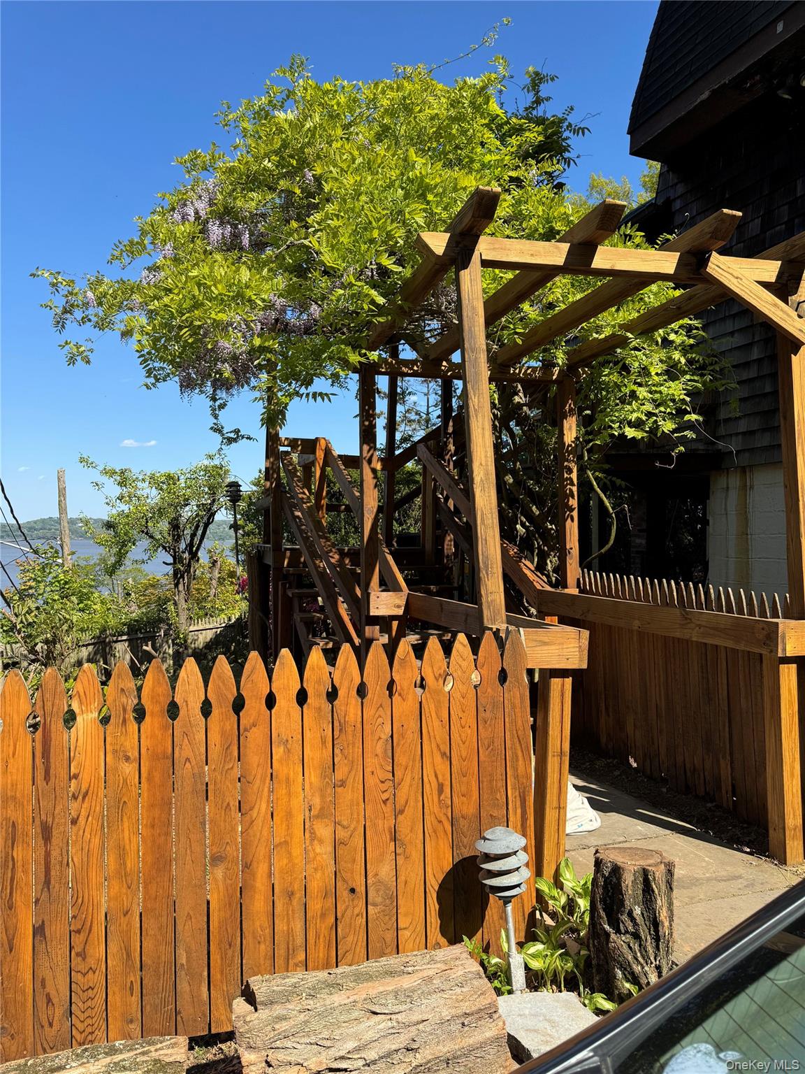 45 Upper Ritie Street Piermont, NY 10968 - Photo 4 of 30 a view of a patio with table and chairs with wooden fence