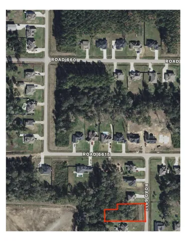 a view of a table and chairs in the garden