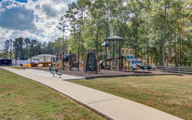 a view of a backyard with sitting area