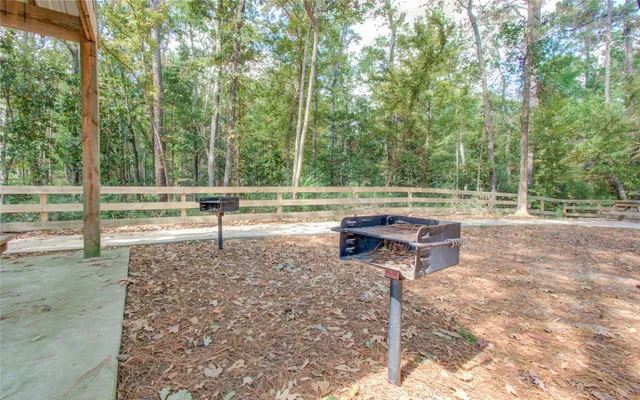 a view of a house with a yard and garage