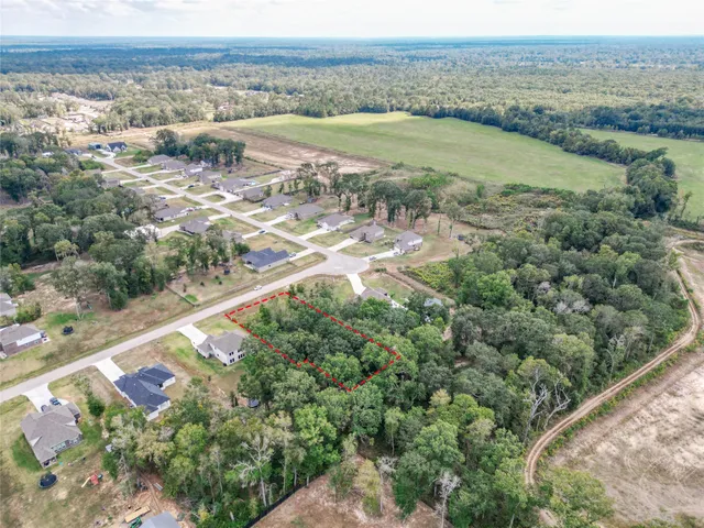 an aerial view of ocean with beach