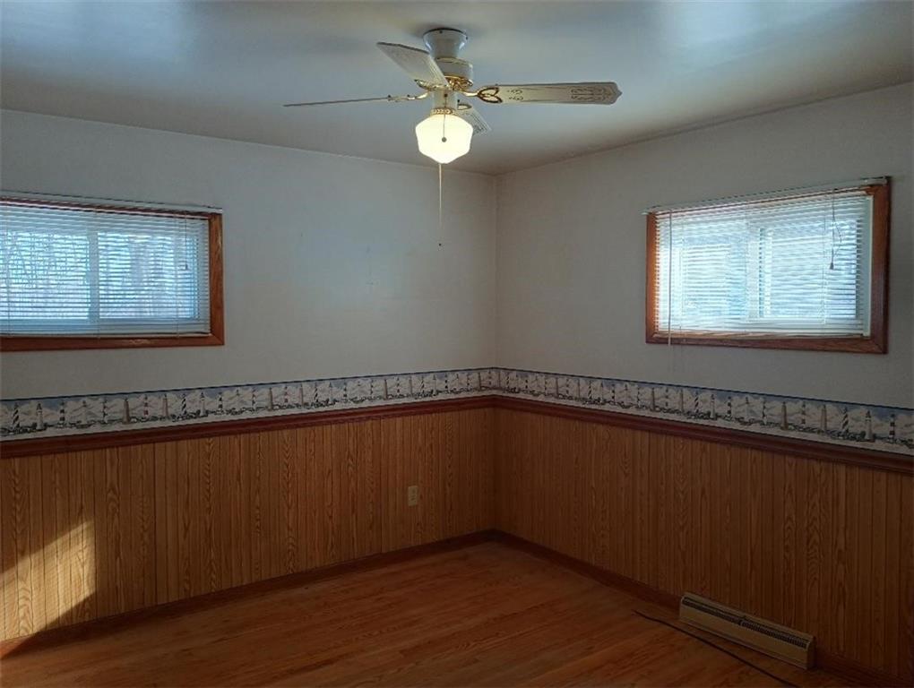 234 Baker Road Greenville, PA 16125 - Photo 11 of 16 a view of an empty room with a window and wooden floor