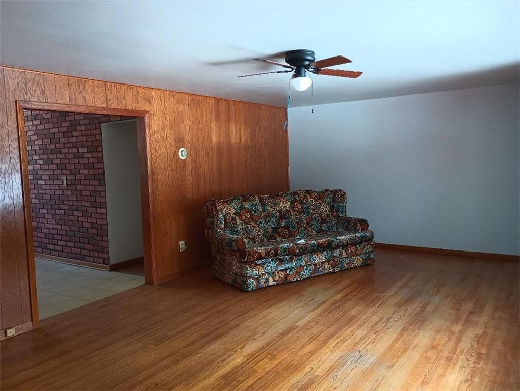 234 Baker Road Greenville, PA 16125 - Photo 8 of 16 a living room with hard wood floors and a ceiling fan