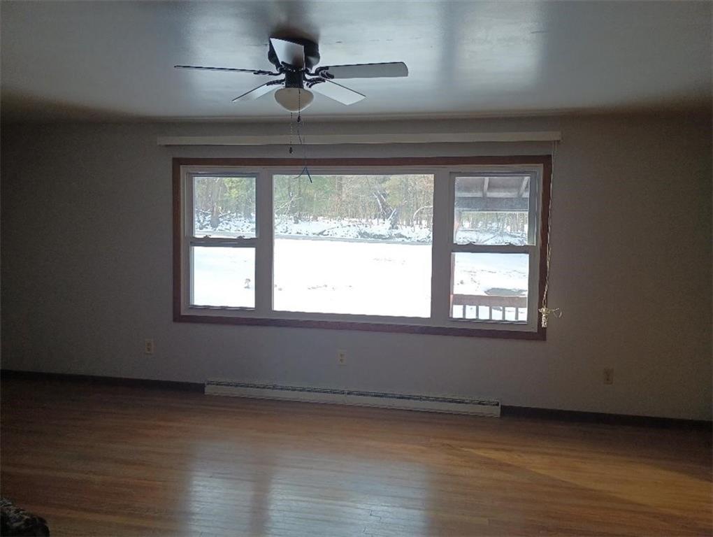 234 Baker Road Greenville, PA 16125 - Photo 9 of 16 a view of an empty room window and wooden floor