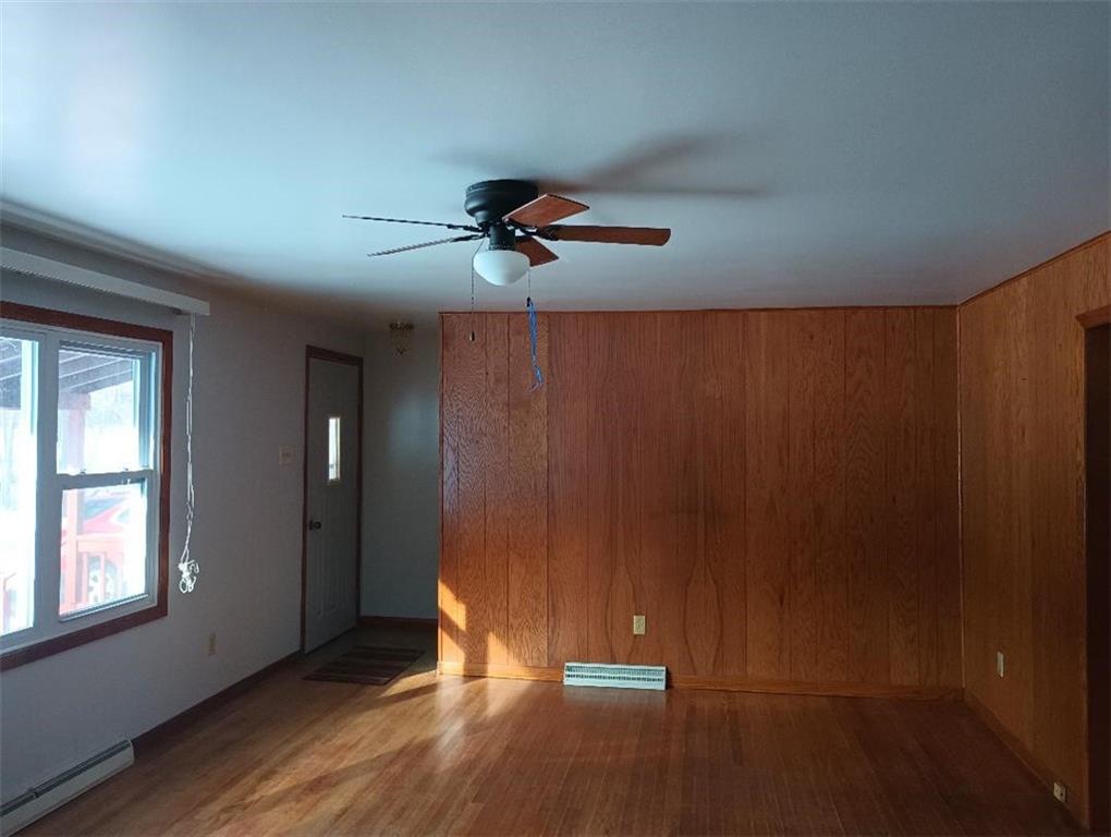 234 Baker Road Greenville, PA 16125 - Photo 10 of 16 wooden floor in an empty room with a window