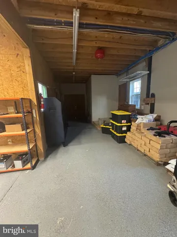 a view of a livingroom with furniture and a garage