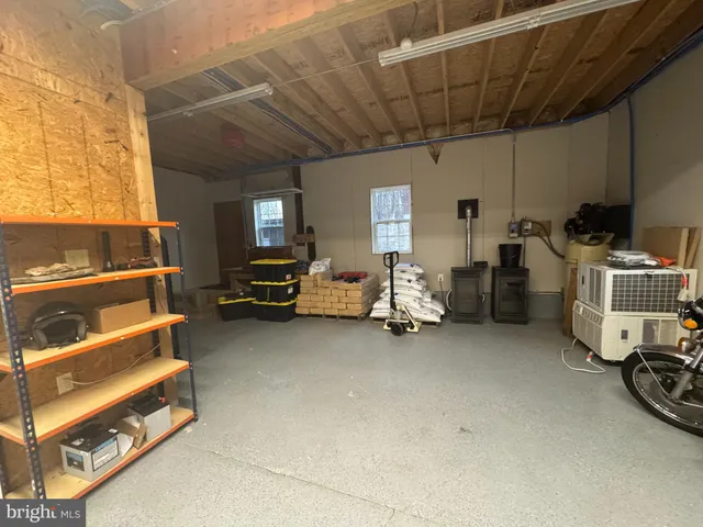 a view of a livingroom with wooden floor and a window