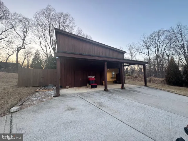 a view of a house with a snow in the yard