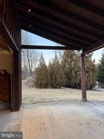 a view of the house with a yard