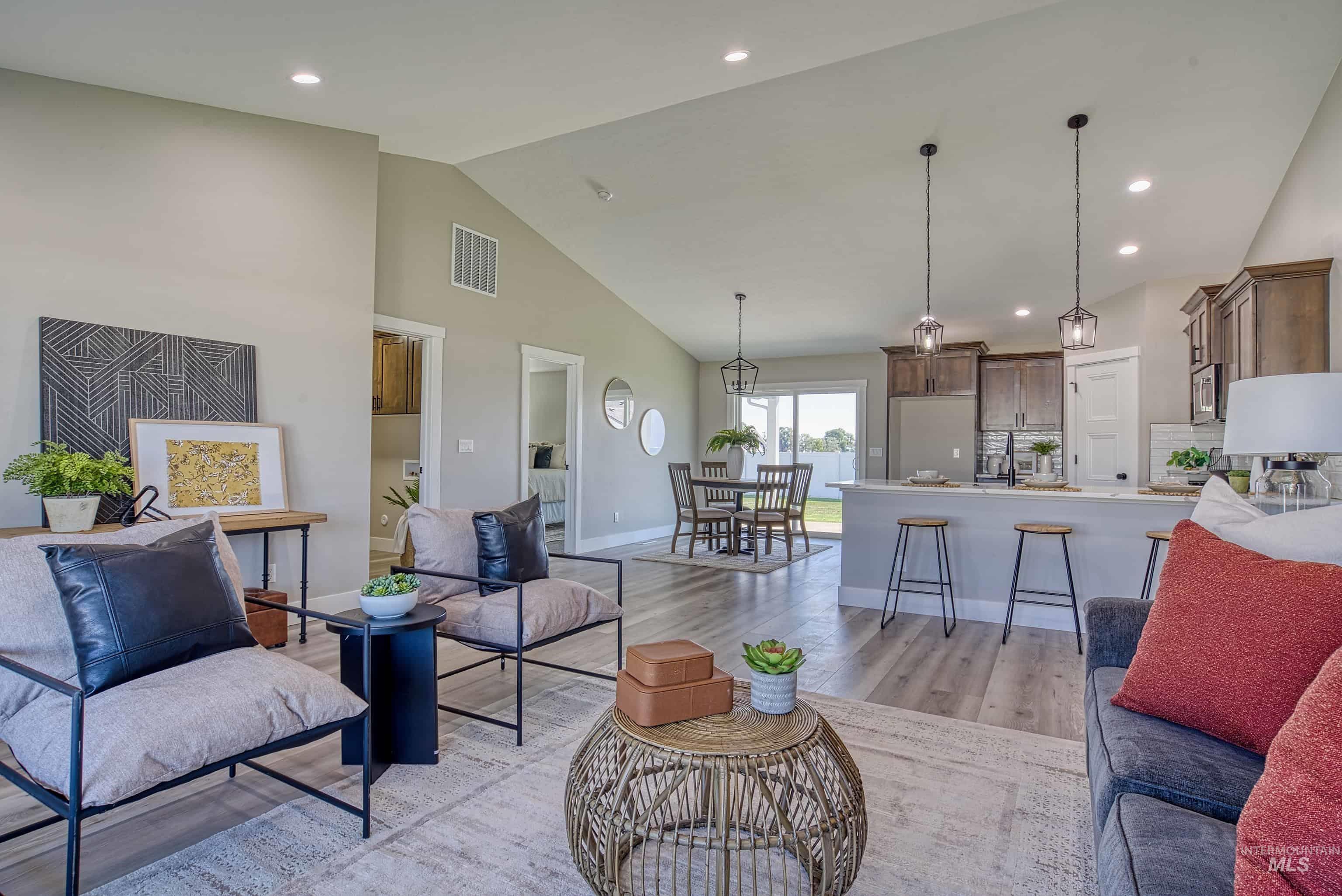 960 Campbell Street Vale, OR 97918 - Photo 14 of 49 Open-concept living area featuring vaulted ceilings, wood-finish flooring, and recessed lighting