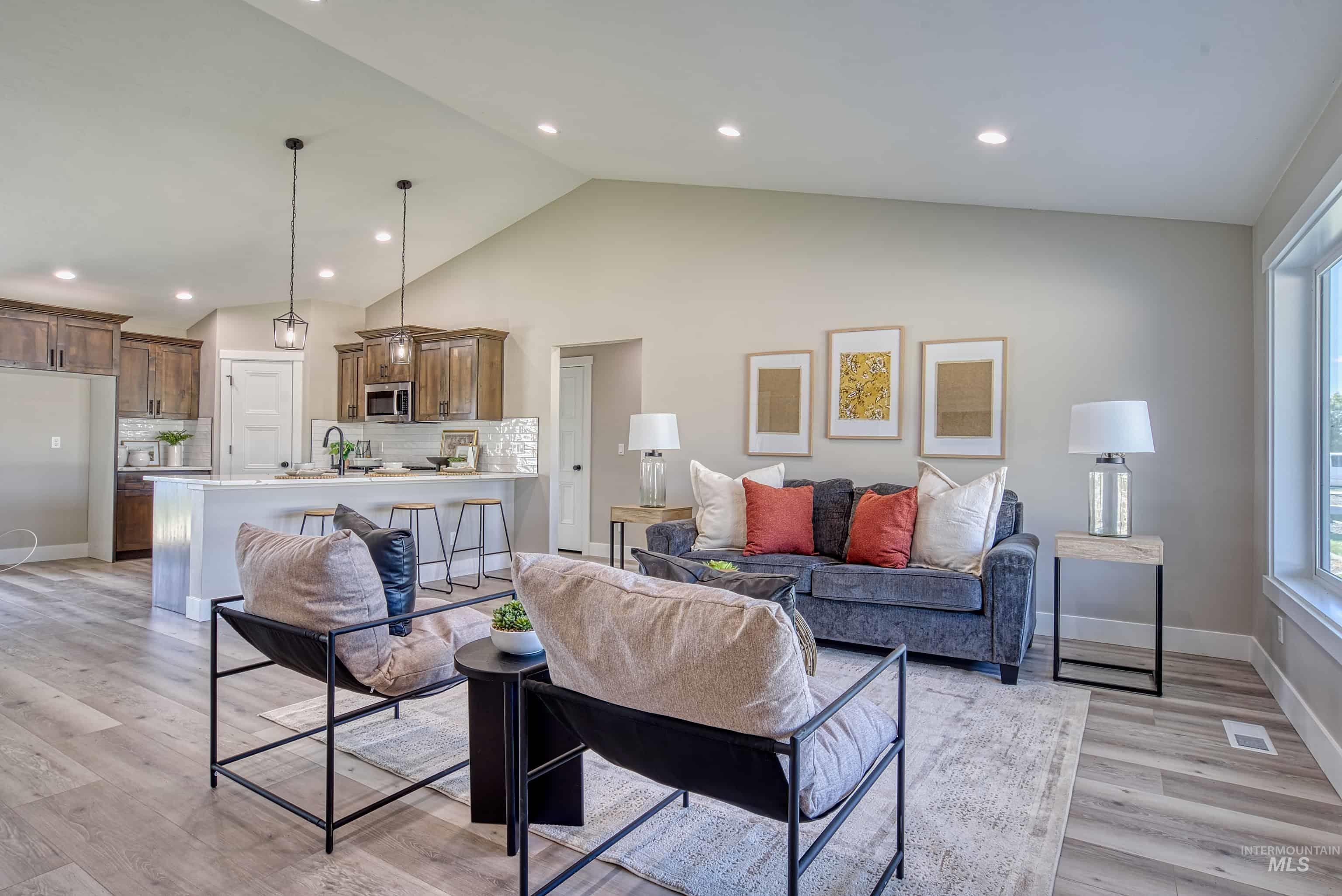 960 Campbell Street Vale, OR 97918 - Photo 15 of 49 Open-concept living space featuring wood-finish flooring, recessed lighting, and vaulted ceilings