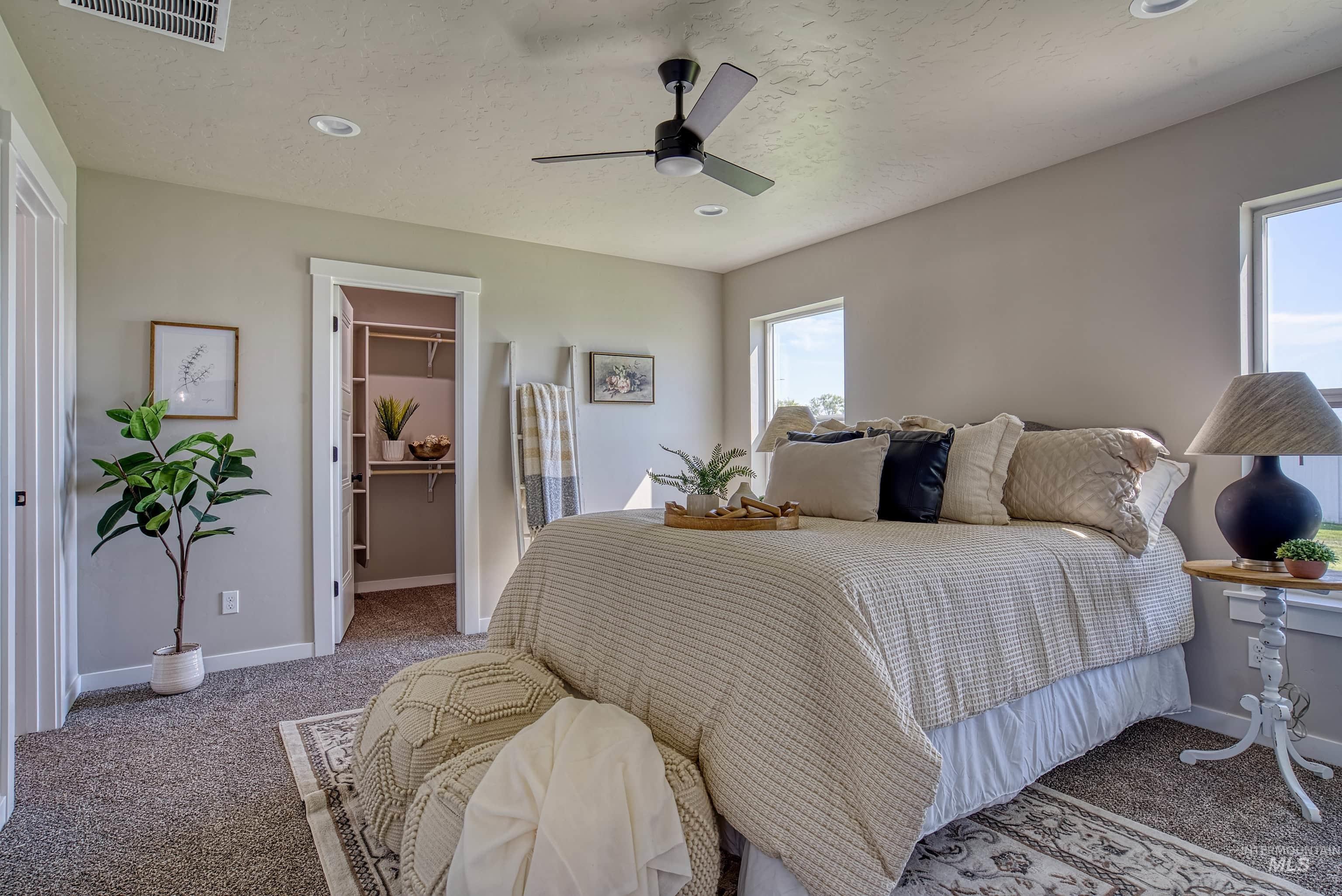960 Campbell Street Vale, OR 97918 - Photo 18 of 49 Carpeted room featuring recessed lighting, a ceiling fan, and two windows providing natural illumination