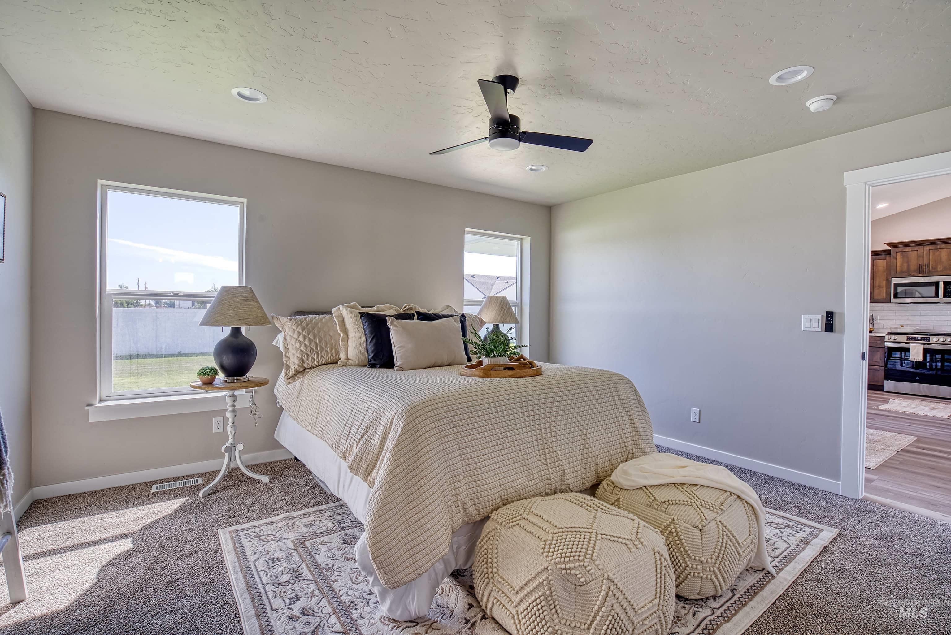 960 Campbell Street Vale, OR 97918 - Photo 20 of 49 Bedroom featuring neutral wall paint, carpet flooring, a ceiling fan with integrated lighting, and recessed ceiling lights
