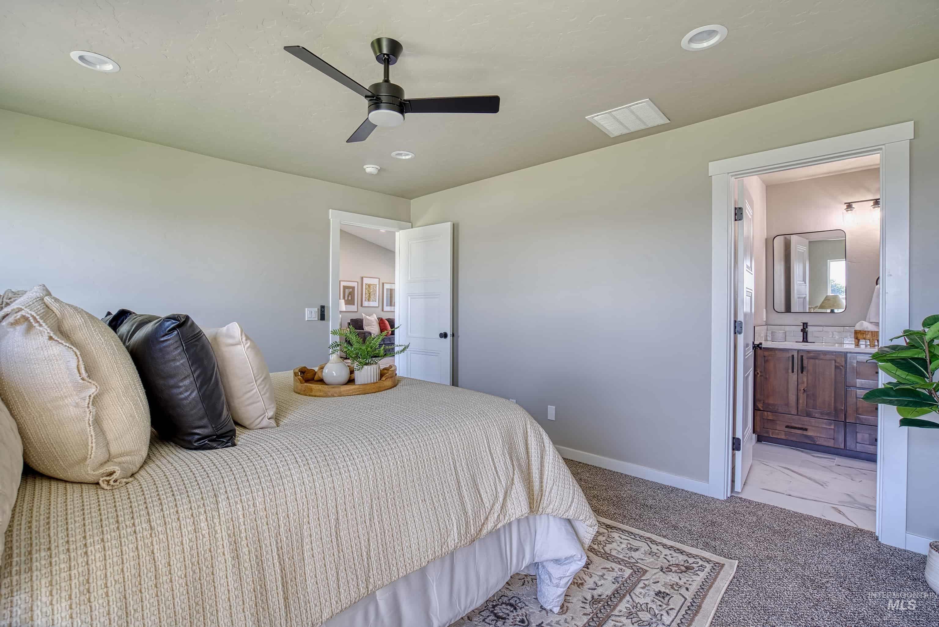 960 Campbell Street Vale, OR 97918 - Photo 21 of 49 Carpeted room featuring a ceiling fan with integrated lighting, recessed lighting, and a doorway to a bathroom