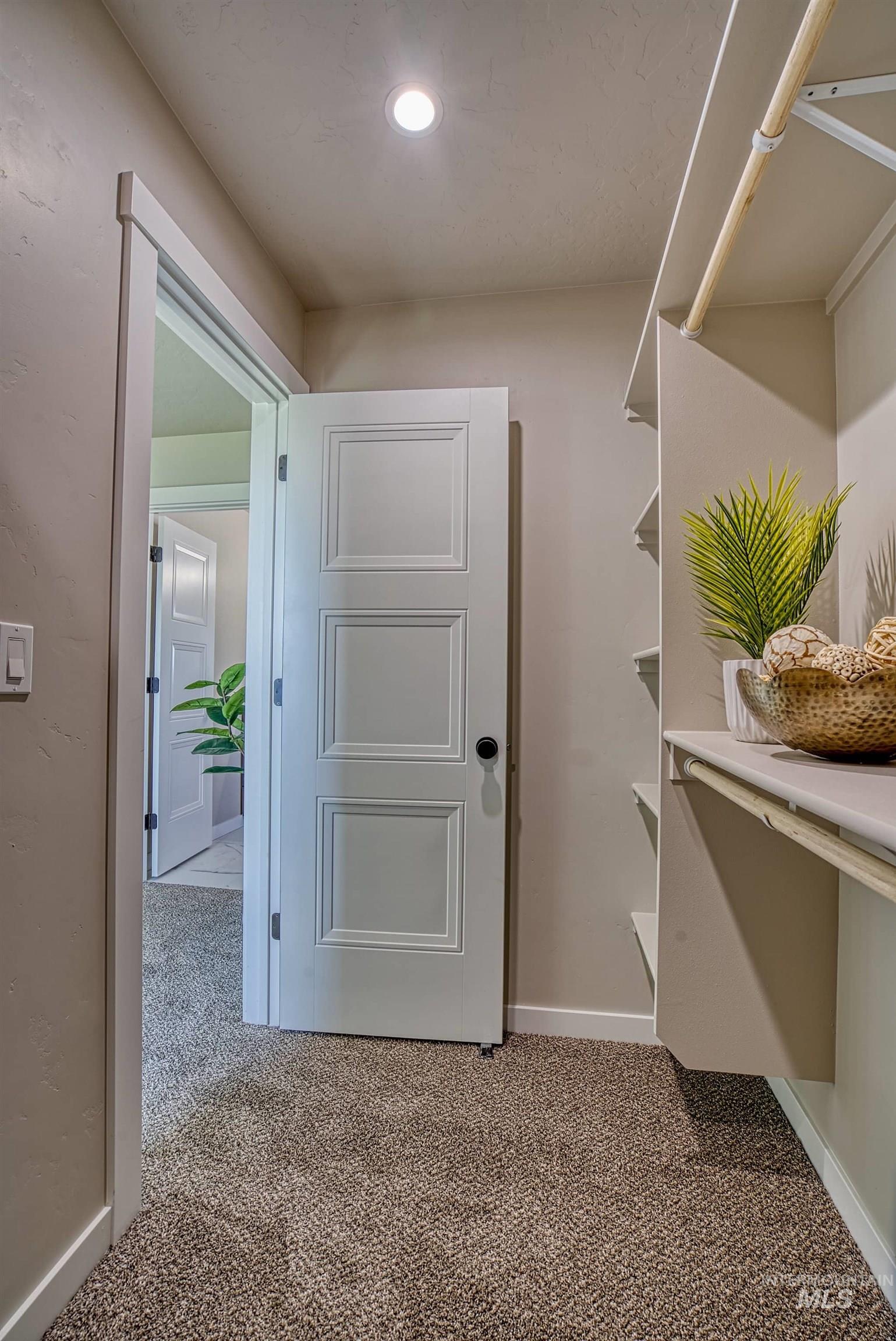 960 Campbell Street Vale, OR 97918 - Photo 35 of 49 Recessed lighting illuminates a carpeted closet space featuring built-in shelving and a clothing rod