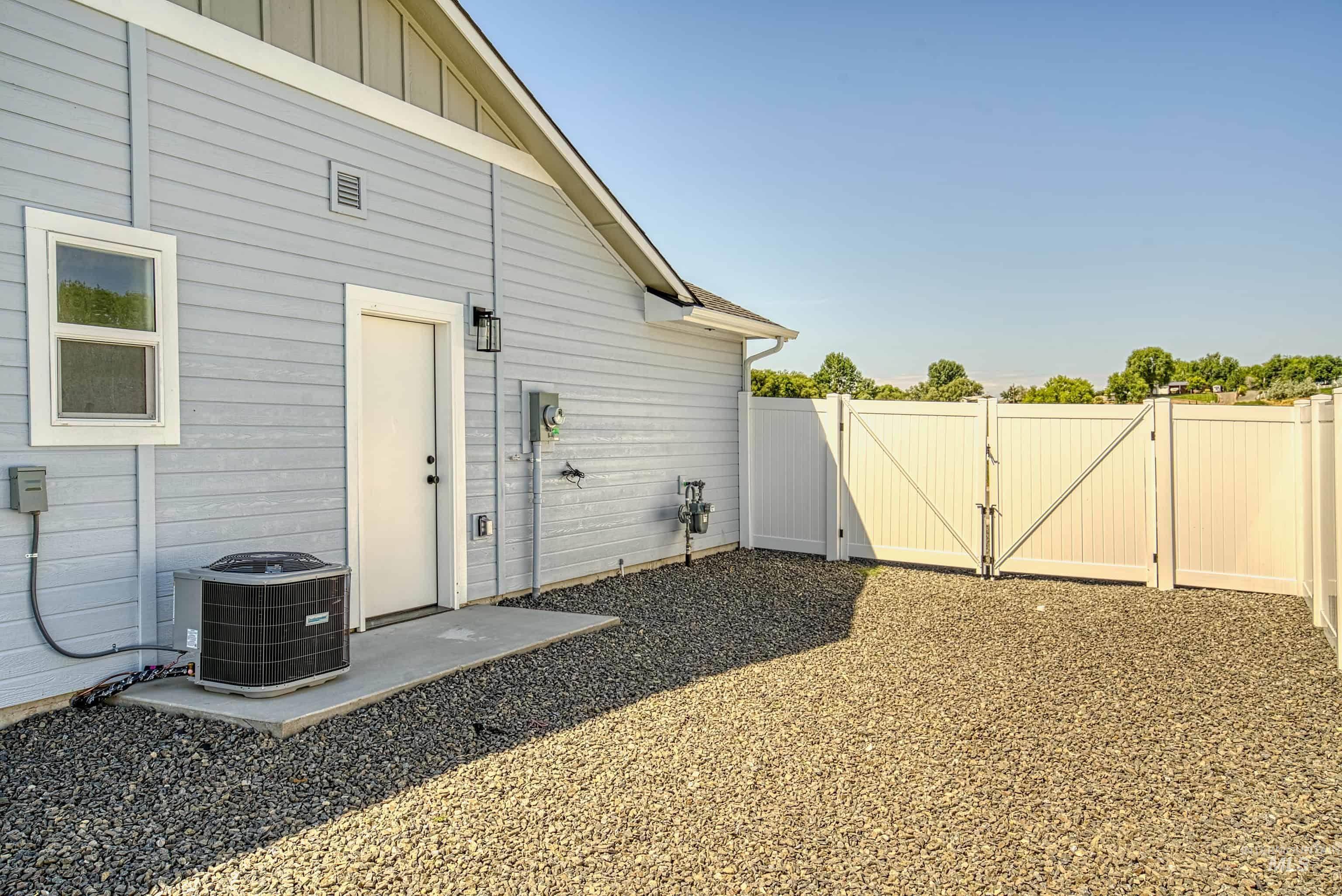 960 Campbell Street Vale, OR 97918 - Photo 38 of 49 Exterior featuring light blue siding, a white window frame, and a white entry door