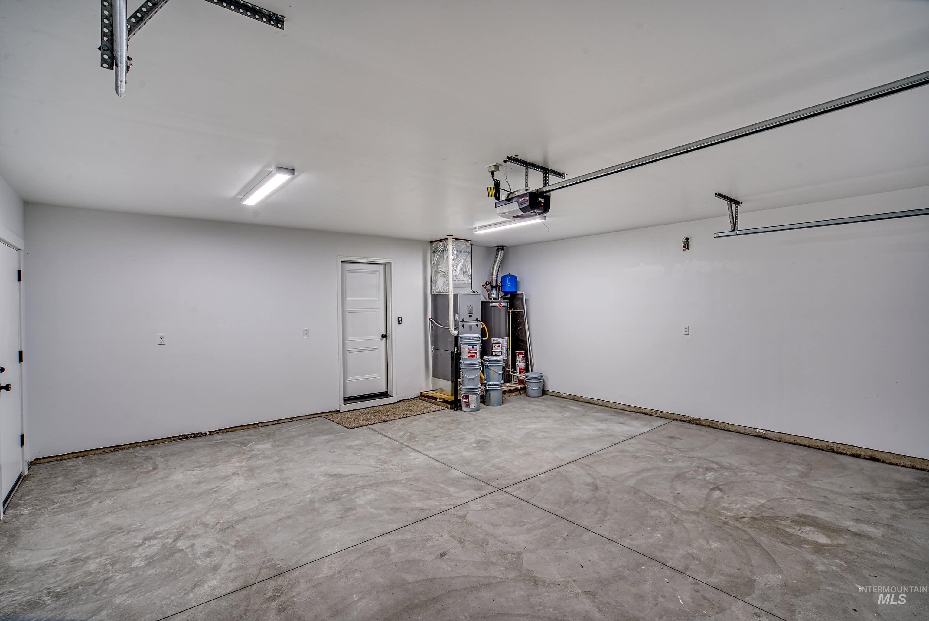 960 Campbell Street Vale, OR 97918 - Photo 44 of 49 Spacious garage featuring a concrete floor, white walls, and overhead lighting