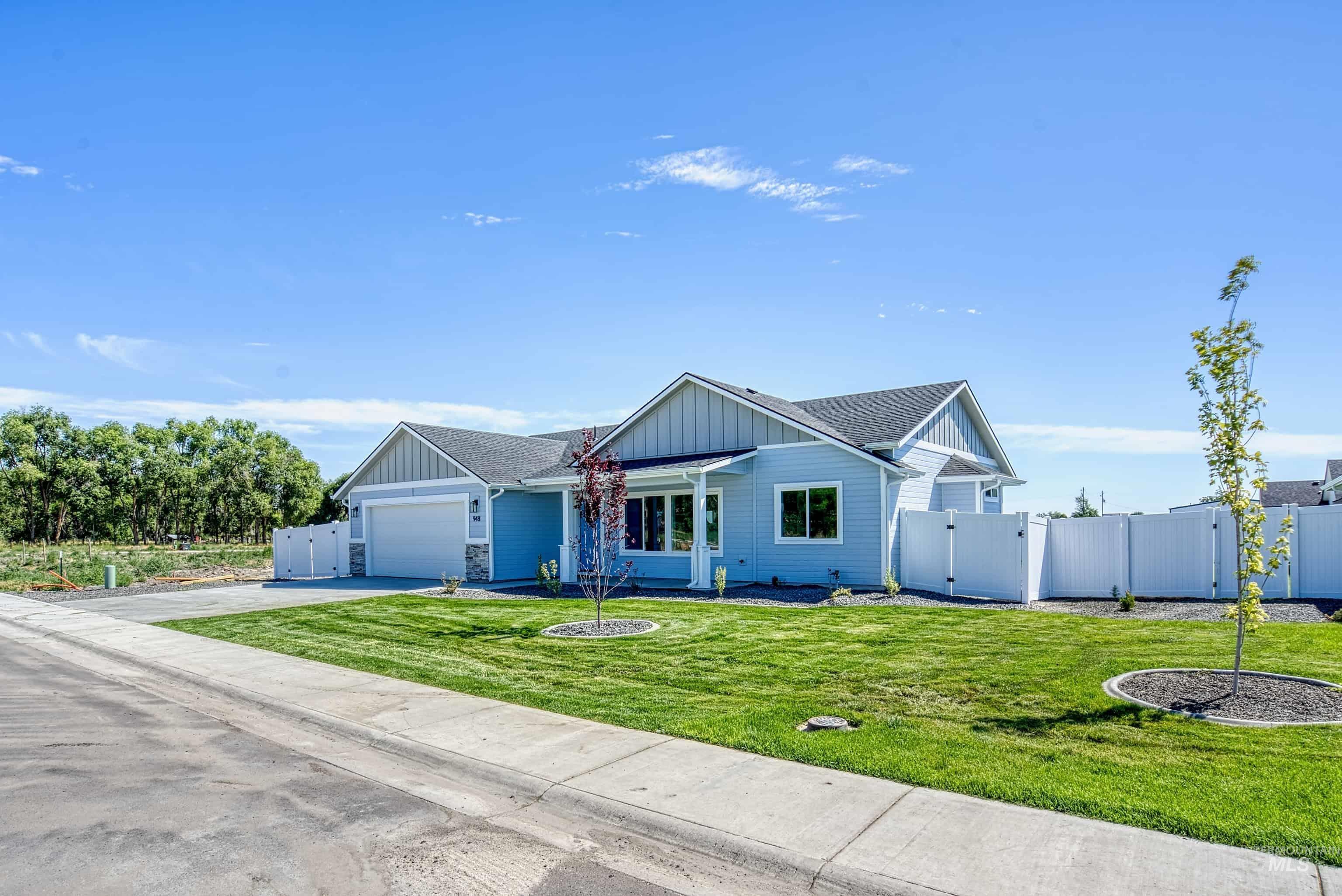 960 Campbell Street Vale, OR 97918 - Photo 46 of 49 Light blue siding exterior with stone accents and a dark shingled roof