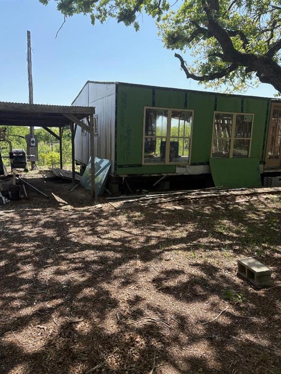 6427 South Fm Road Millsap, TX 76066 - Photo 3 of 6 a front view of a house with a yard