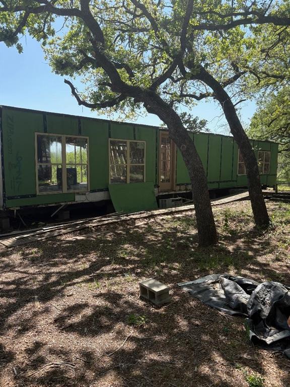 6427 South Fm Road Millsap, TX 76066 - Photo 4 of 6 a front view of a house with a yard