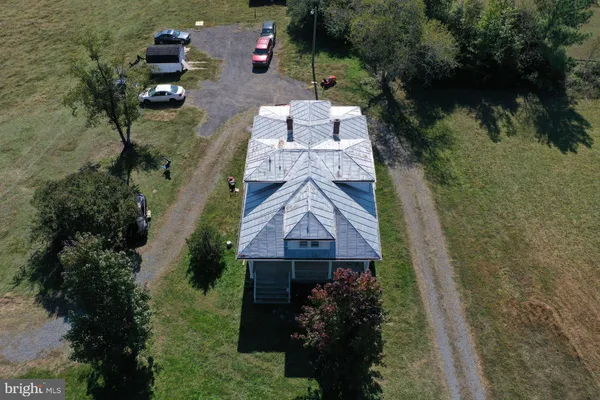 an aerial view of houses with yard