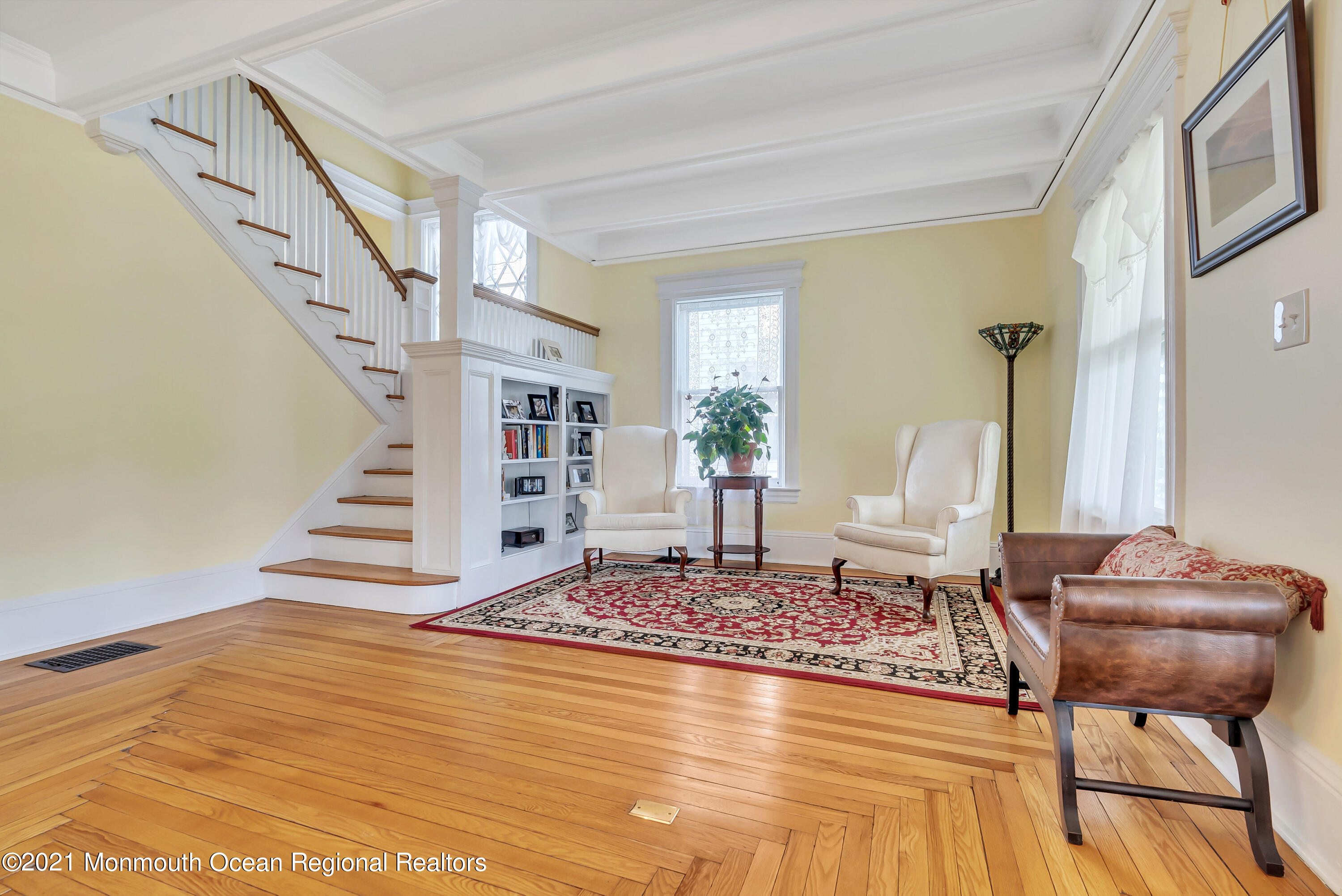 236 Allen Avenue Allenhurst, NJ 07711 - Photo 16 of 46 a living room with a couch and a rug