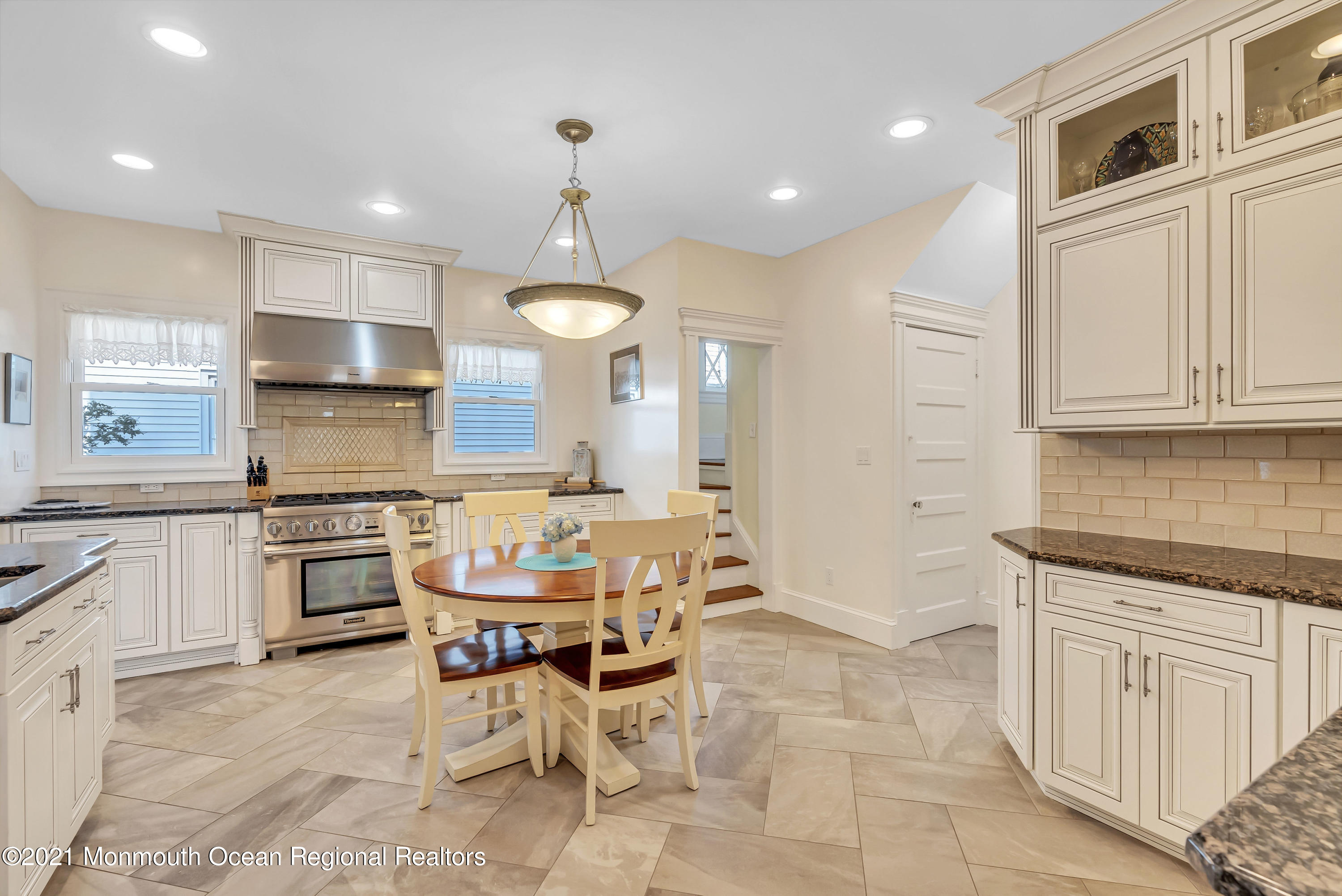 236 Allen Avenue Allenhurst, NJ 07711 - Photo 23 of 46 a kitchen with granite countertop a stove a sink and a refrigerator