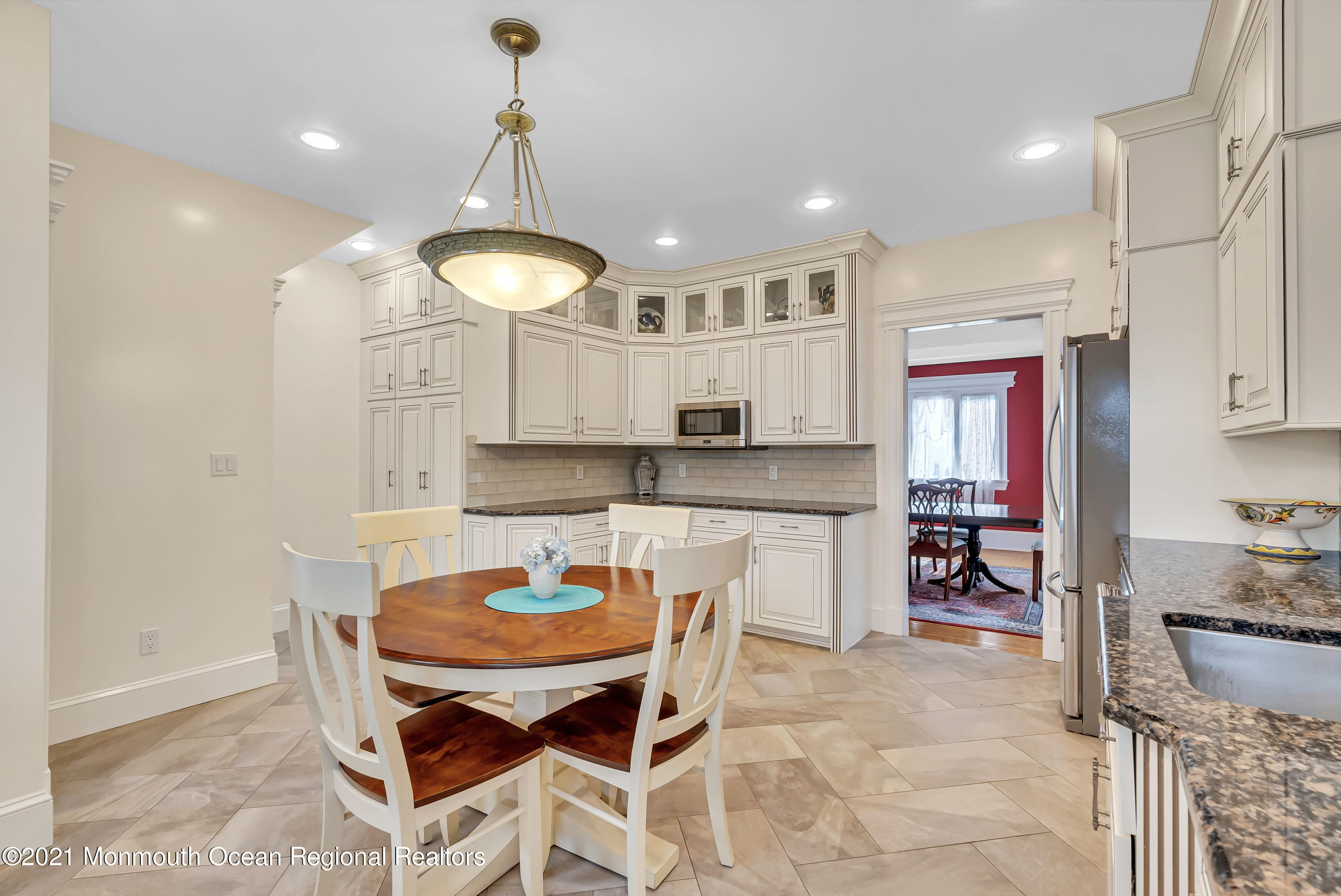236 Allen Avenue Allenhurst, NJ 07711 - Photo 24 of 46 a kitchen with a table and chairs in it