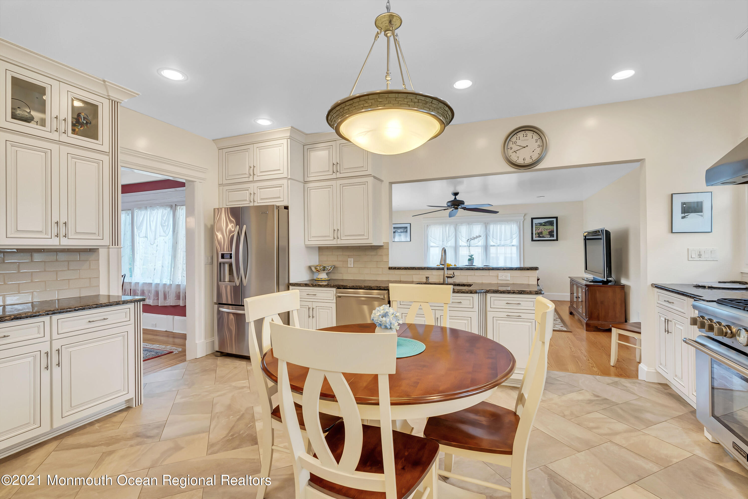 236 Allen Avenue Allenhurst, NJ 07711 - Photo 25 of 46 a kitchen with stainless steel appliances kitchen island granite countertop a sink a stove a refrigerator cabinets and chairs
