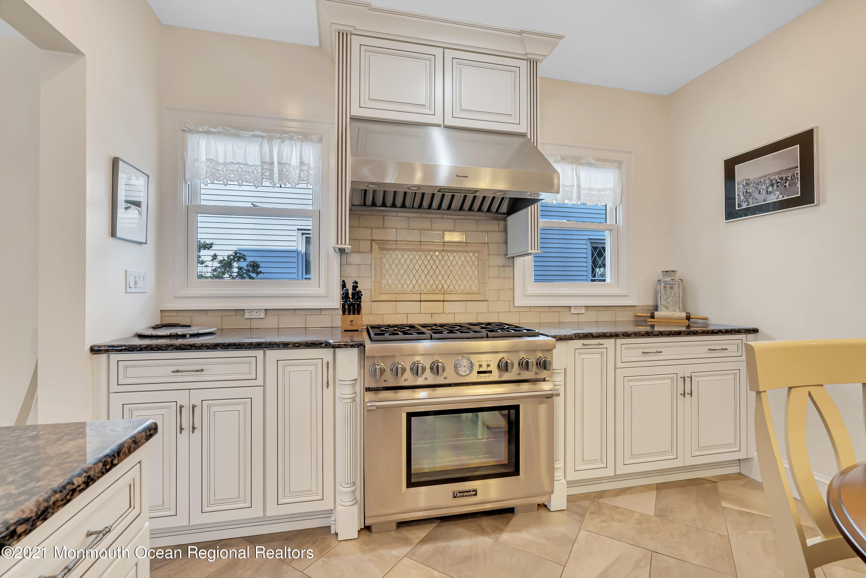 236 Allen Avenue Allenhurst, NJ 07711 - Photo 28 of 46 a kitchen with granite countertop a stove top oven cabinetry and a sink