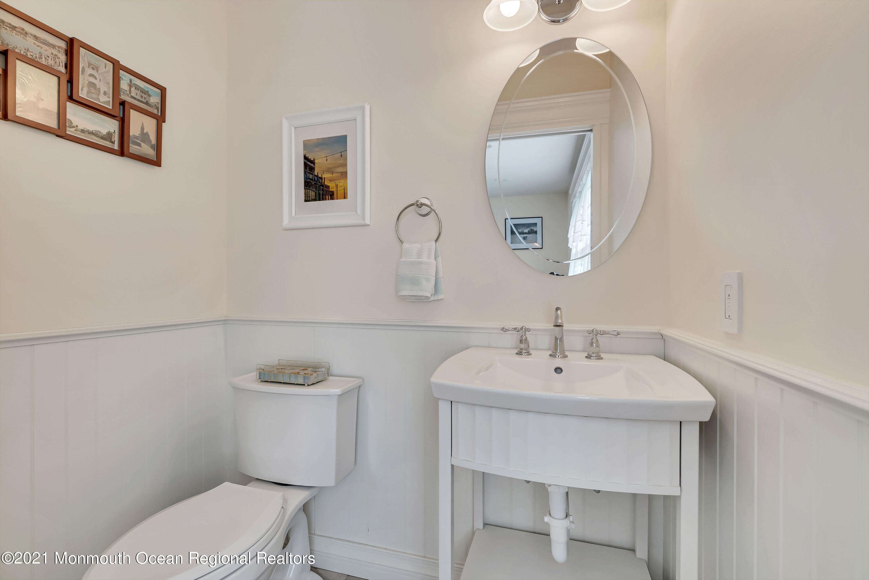 236 Allen Avenue Allenhurst, NJ 07711 - Photo 30 of 46 a bathroom with a toilet a sink and mirror