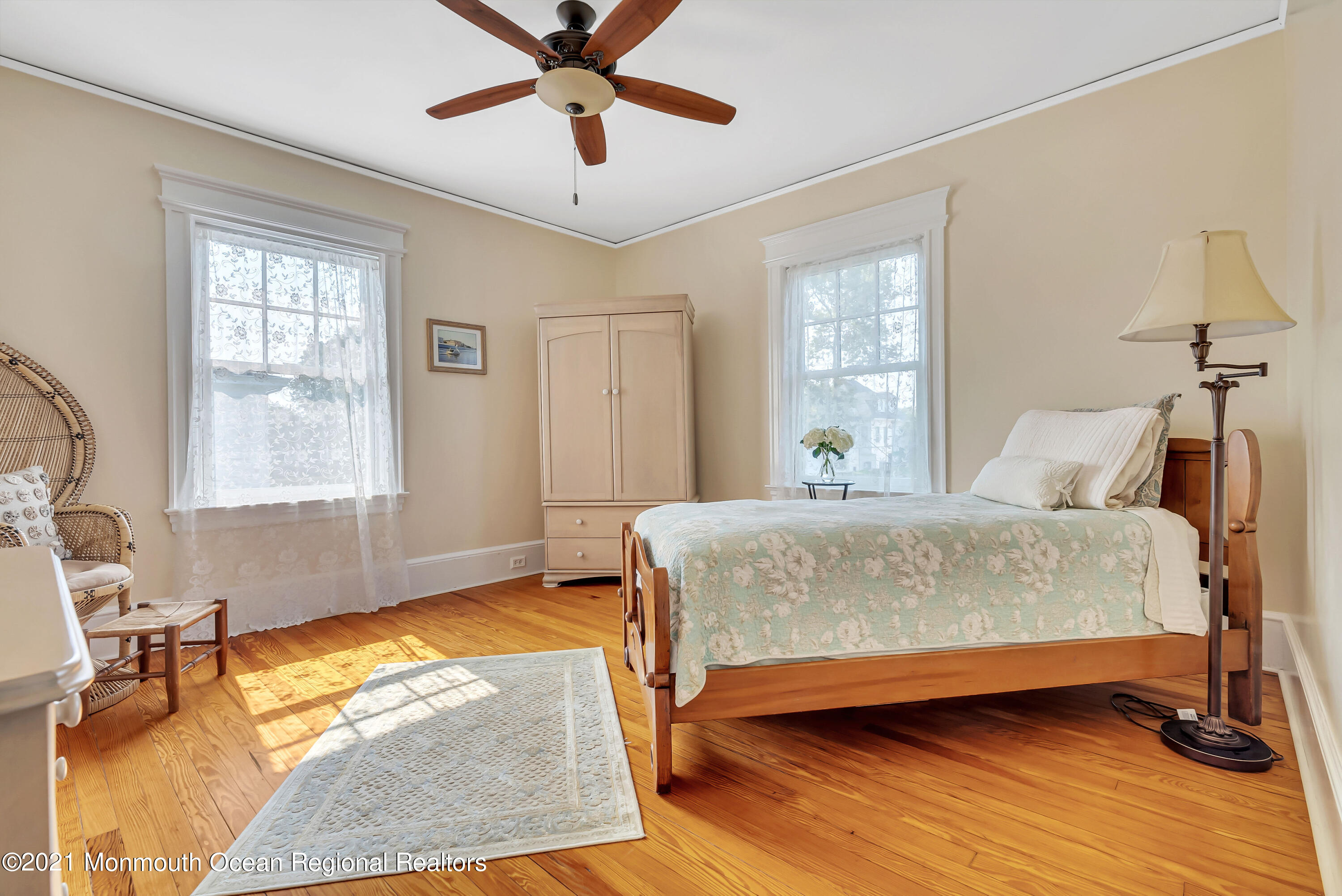 236 Allen Avenue Allenhurst, NJ 07711 - Photo 39 of 46 a bedroom with a bed and wooden floor