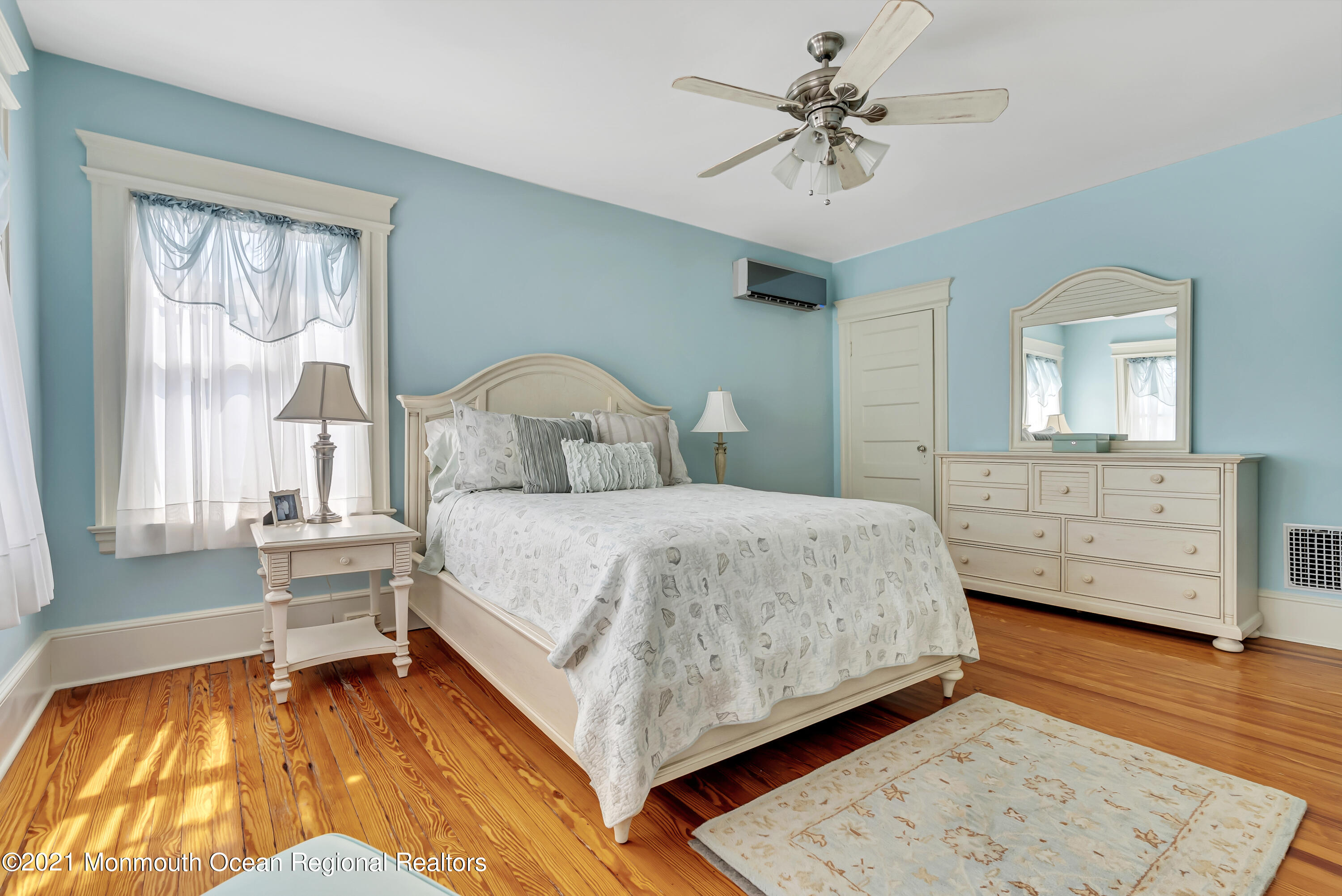 236 Allen Avenue Allenhurst, NJ 07711 - Photo 40 of 46 a spacious bedroom with a bed and a dresser
