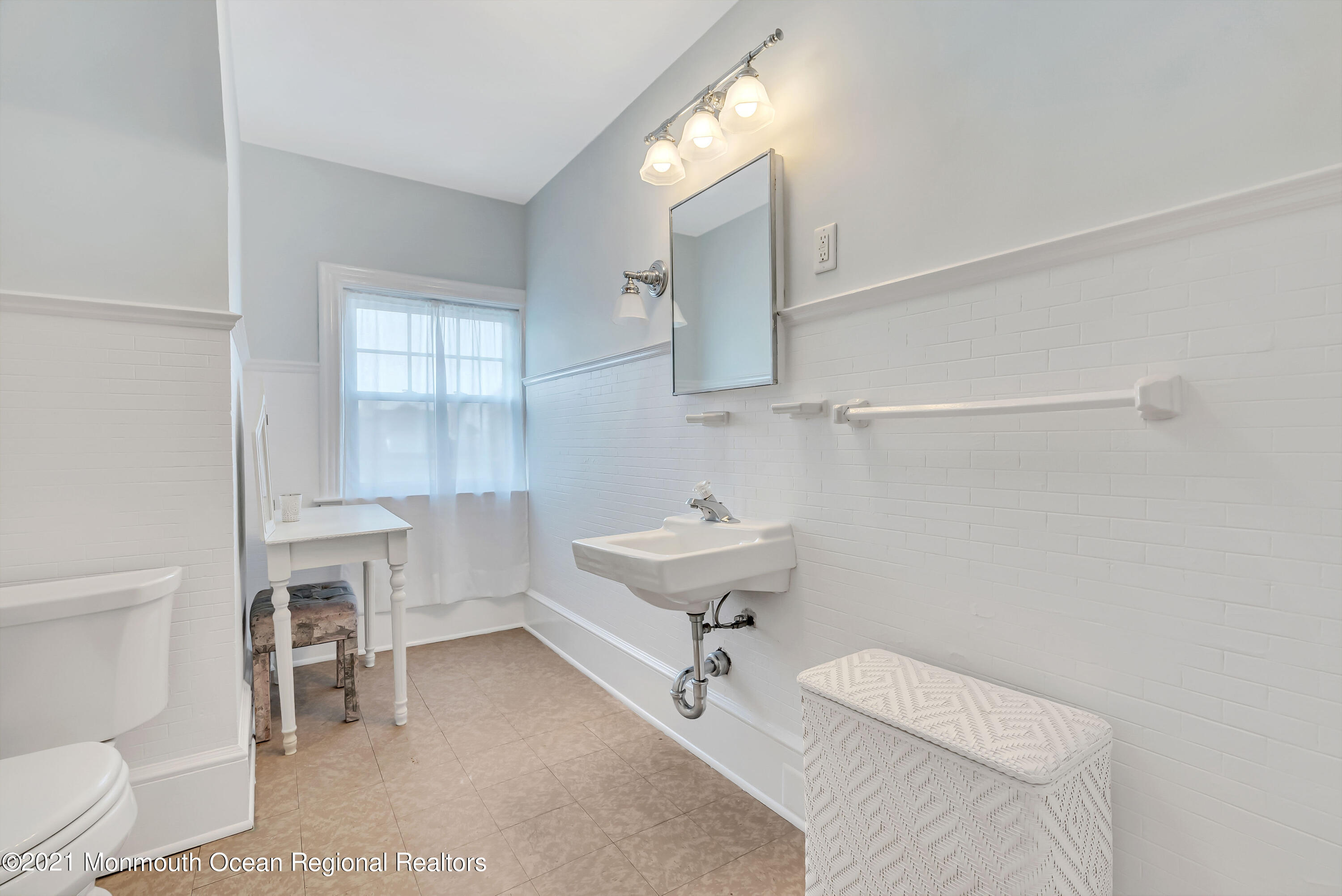 236 Allen Avenue Allenhurst, NJ 07711 - Photo 45 of 46 a bathroom with a sink a toilet and a bathtub