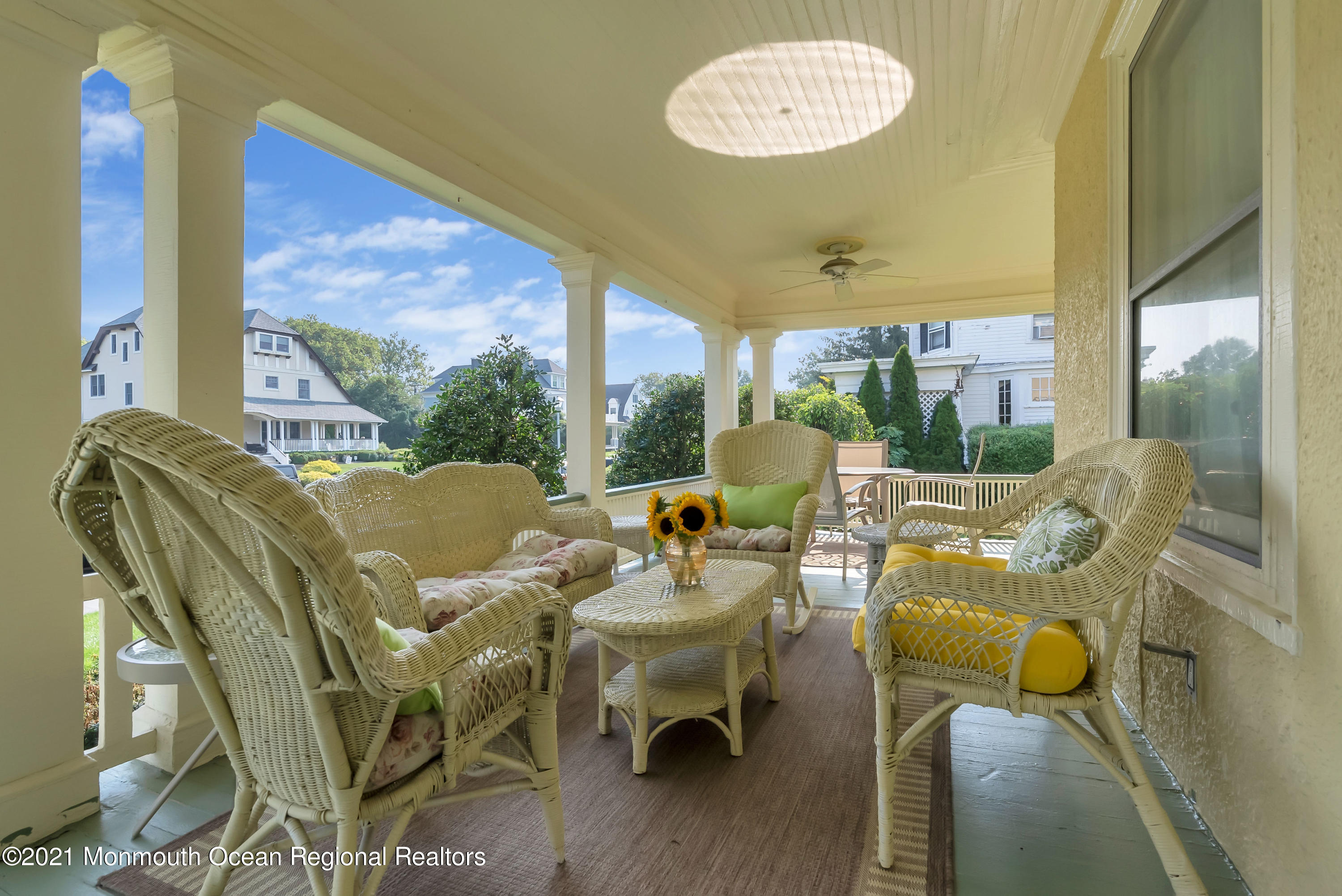 236 Allen Avenue Allenhurst, NJ 07711 - Photo 10 of 46 a balcony with furniture and a large window