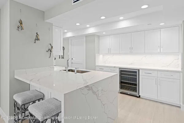 a bedroom with a bed and large window