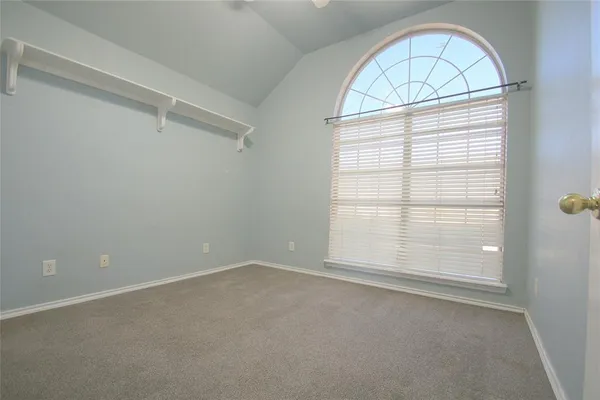 an empty room with a empty space and windows