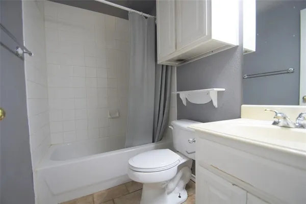 a bathroom with a sink a toilet and a bathtub