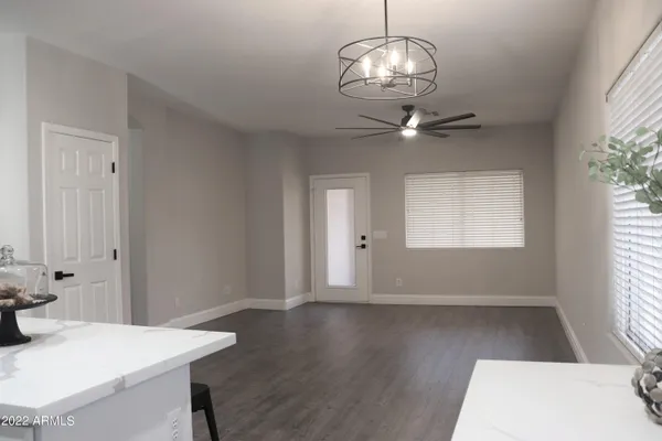 a view of kitchen with furniture and wooden floor
