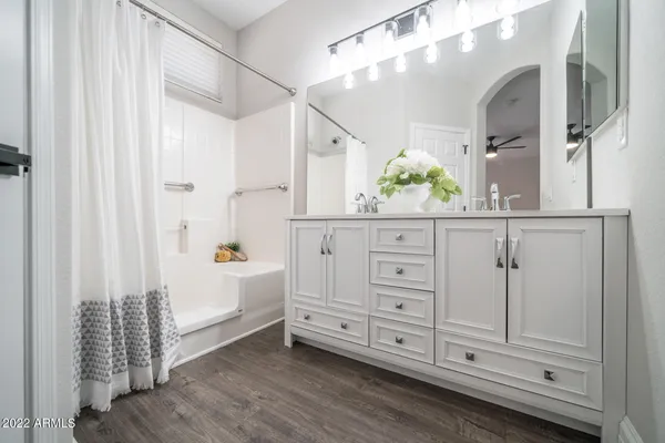 a bathroom with a tub and shower curtain