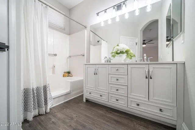 a bathroom with a tub and shower curtain