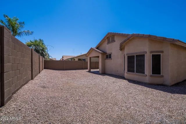 a house view with a backyard space