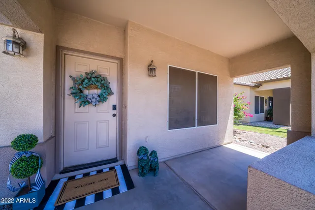 a view of an entryway with table and chair