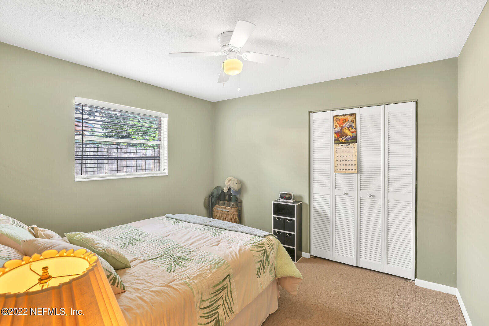 13 Sailfish Drive Ponte Vedra Beach, FL 32082 - Photo 11 of 34 a bedroom with a bed and a chandelier