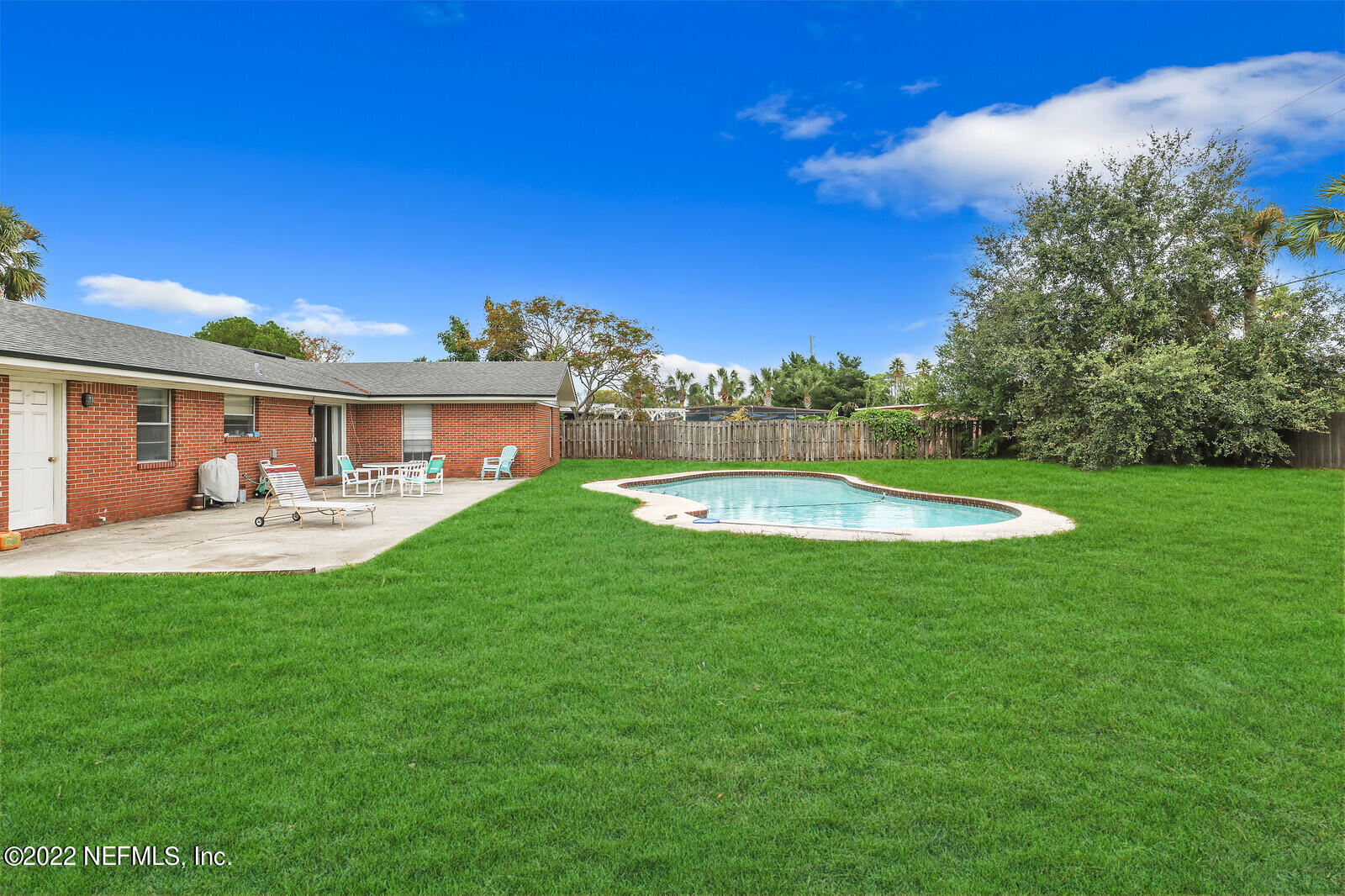 13 Sailfish Drive Ponte Vedra Beach, FL 32082 - Photo 20 of 34 a view of a house with a backyard porch and a garden