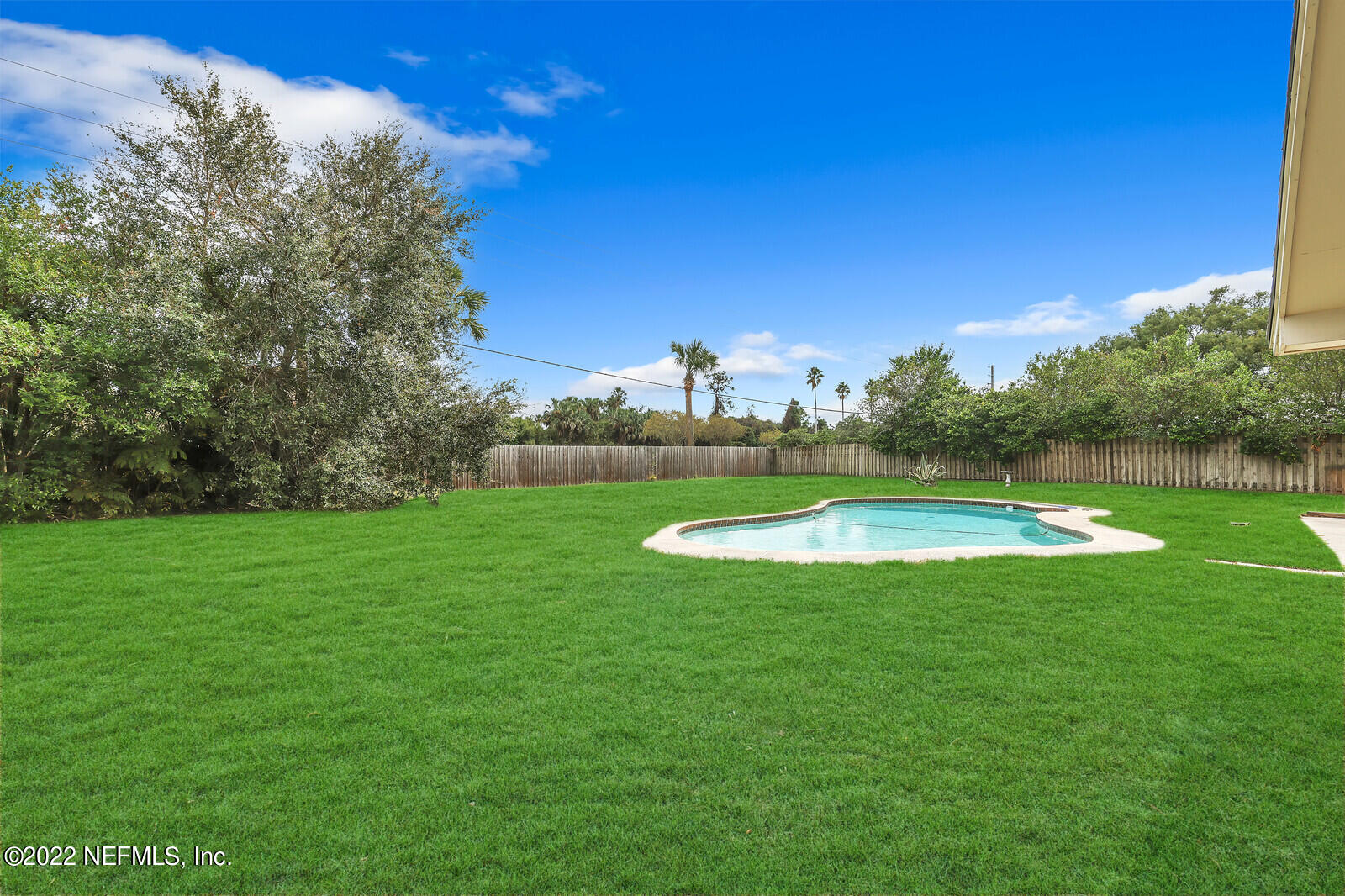 13 Sailfish Drive Ponte Vedra Beach, FL 32082 - Photo 24 of 34 a view of a swimming pool with a yard