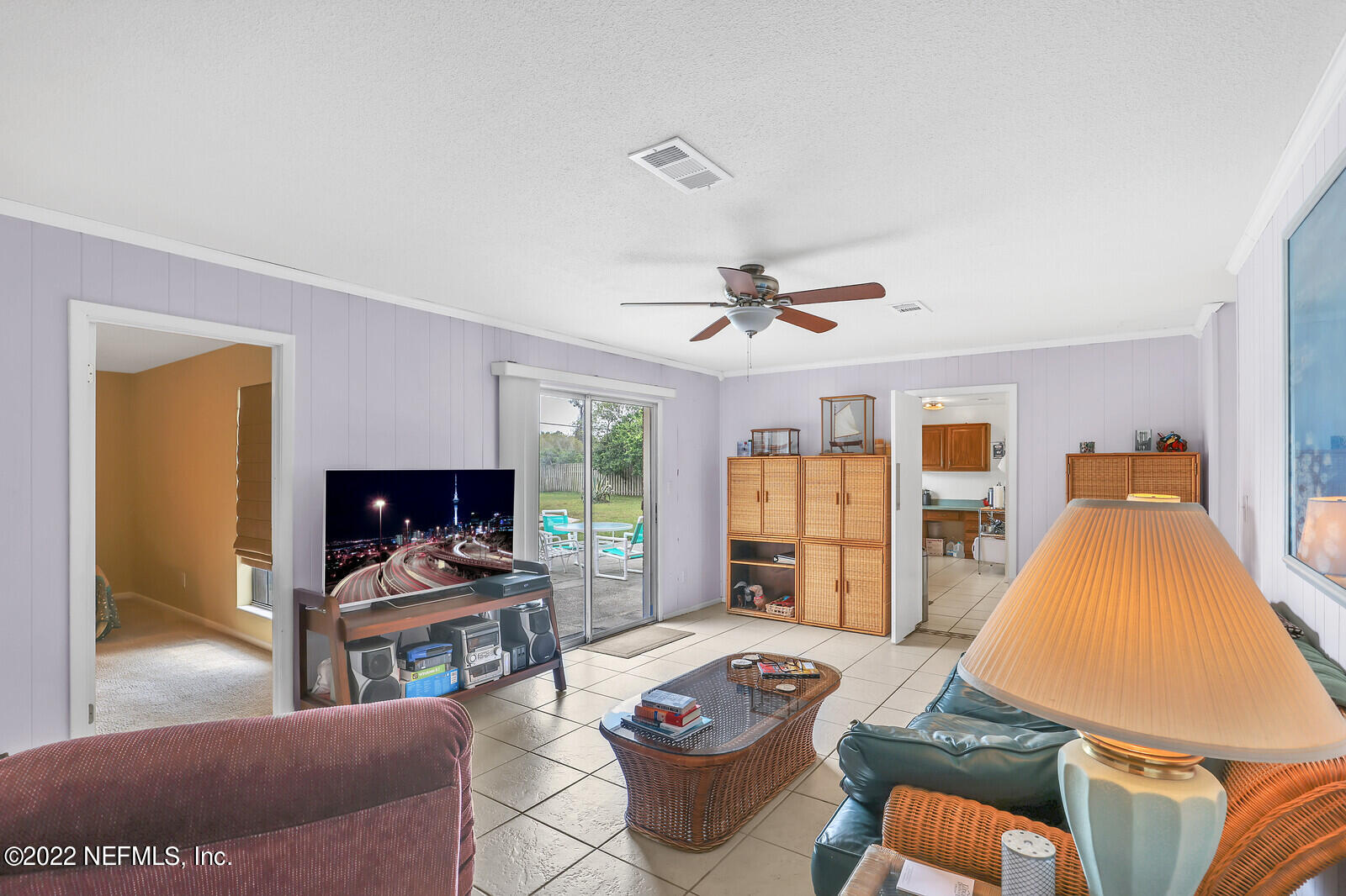 13 Sailfish Drive Ponte Vedra Beach, FL 32082 - Photo 6 of 34 a living room with furniture a fireplace and a flat screen tv