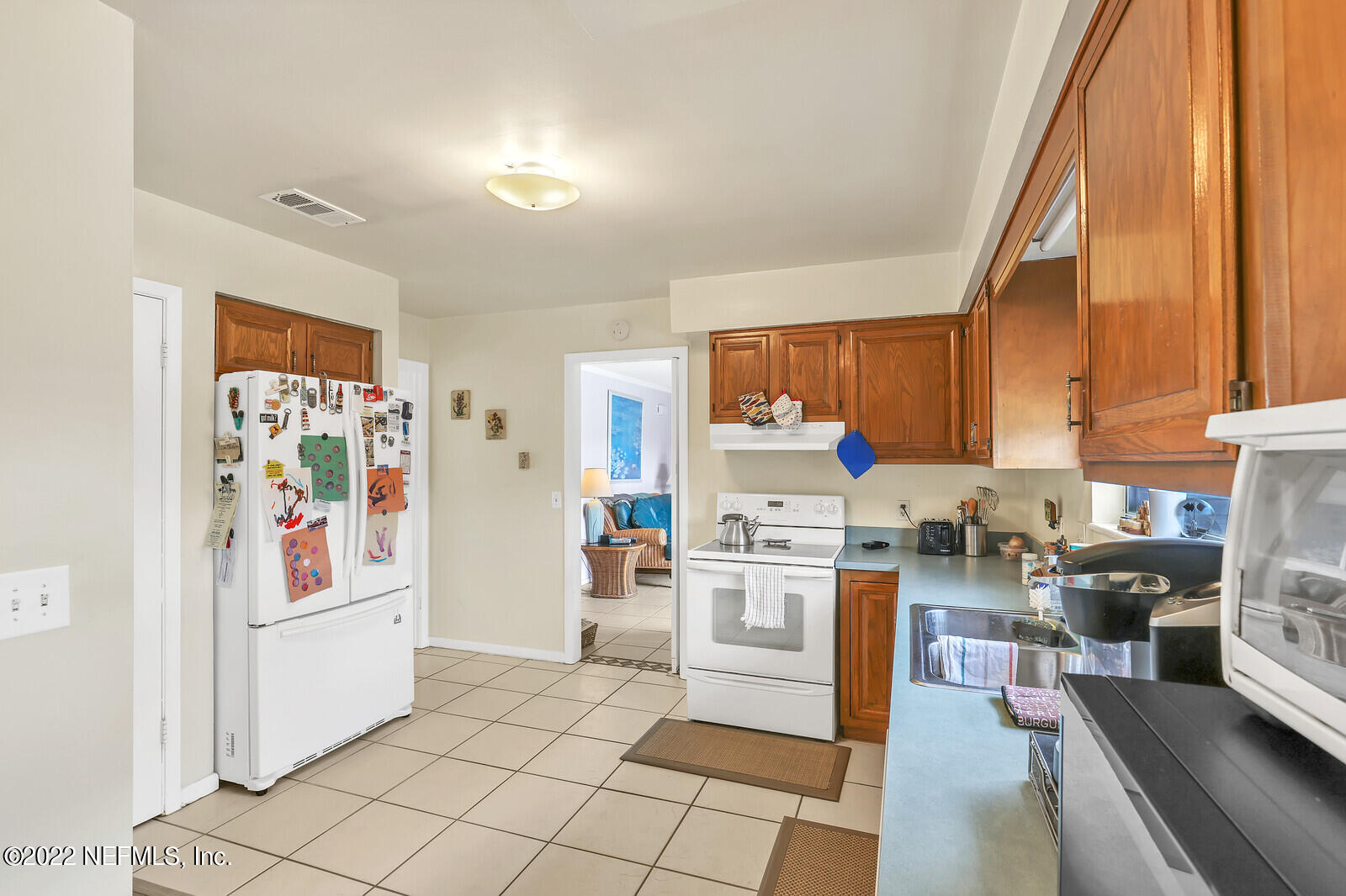 13 Sailfish Drive Ponte Vedra Beach, FL 32082 - Photo 8 of 34 a kitchen with stainless steel appliances a stove a sink and cabinets